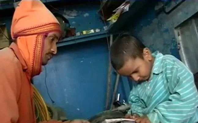 PM Modi helps a kid with hearing impairment in Varanasi
